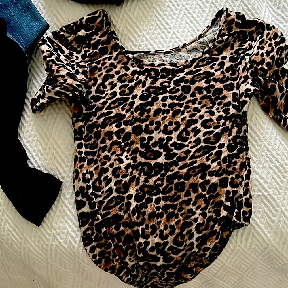 Size small leopard one piece ss with snap bottom.